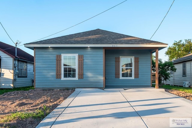 861 Rio Grande St, San Benito, TX 78586 - back of property featuring roof with shingles