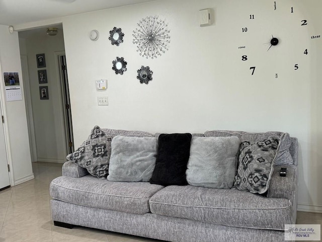 living room featuring light tile patterned flooring