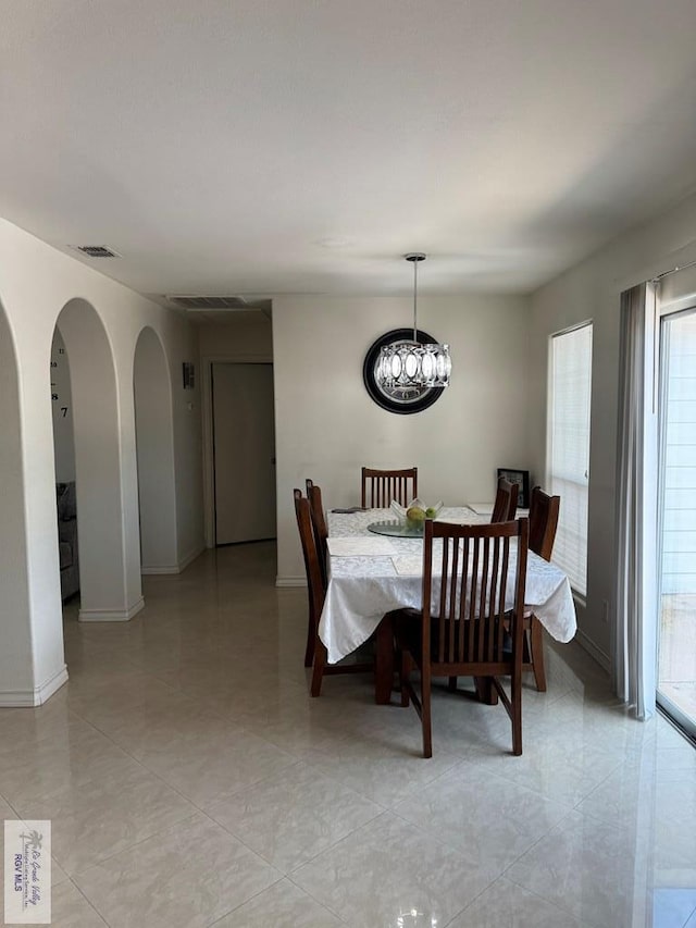 dining room featuring a notable chandelier