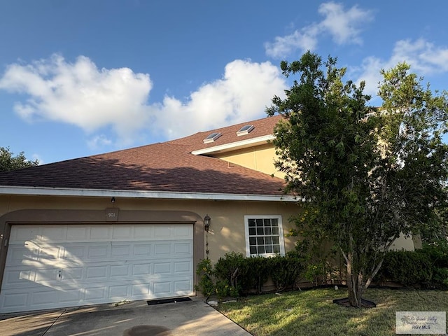 901 Plantation St, Brownsville, TX 78526 - view of front of house featuring roof with shingles, stucco siding, a garage, and concrete driveway