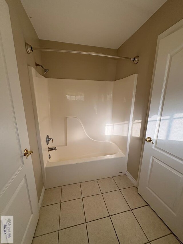 901 Plantation St, Brownsville, TX 78526 - full bathroom featuring tile patterned flooring, bathtub / shower combination, and baseboards