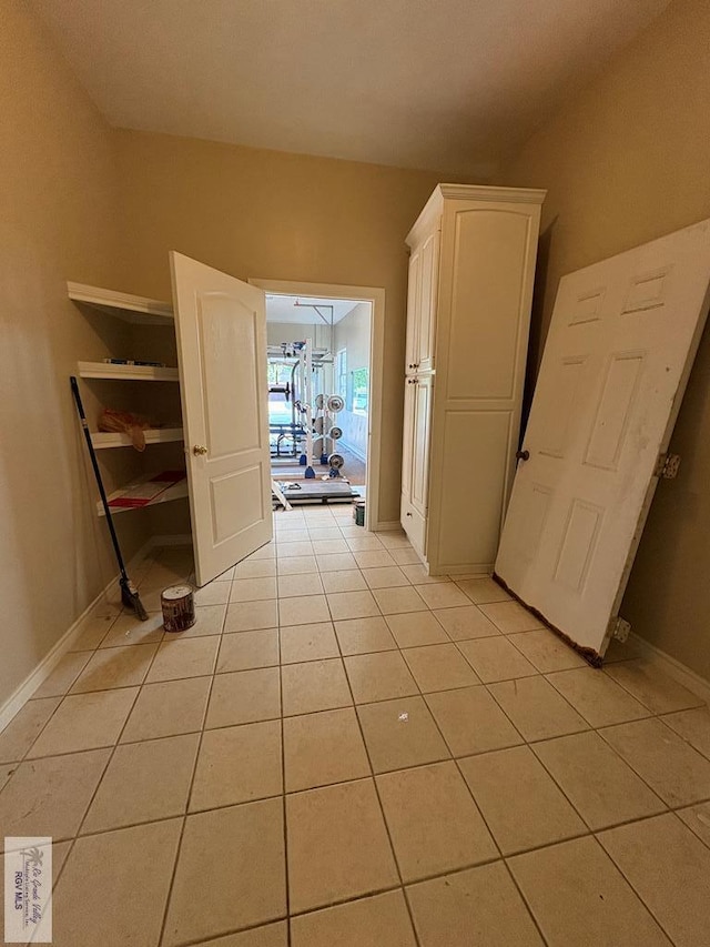 901 Plantation St, Brownsville, TX 78526 - hall featuring light tile patterned floors and baseboards