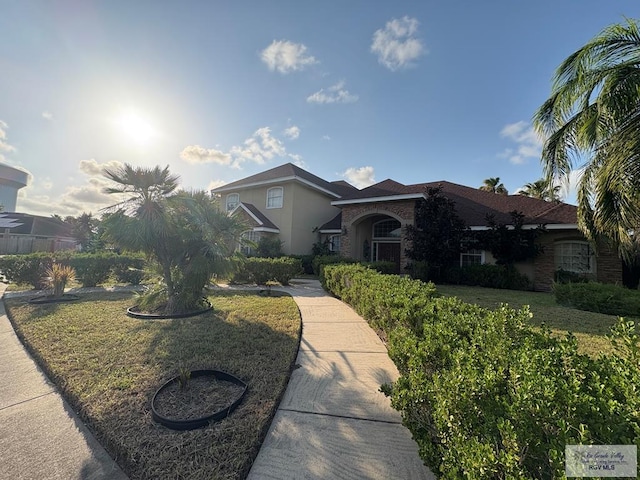 901 Plantation St, Brownsville, TX 78526 - view of front facade featuring stucco siding