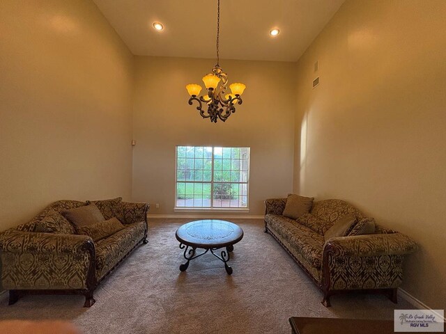 901 Plantation St, Brownsville, TX 78526 - living room featuring a chandelier, carpet floors, a towering ceiling, baseboards, and recessed lighting