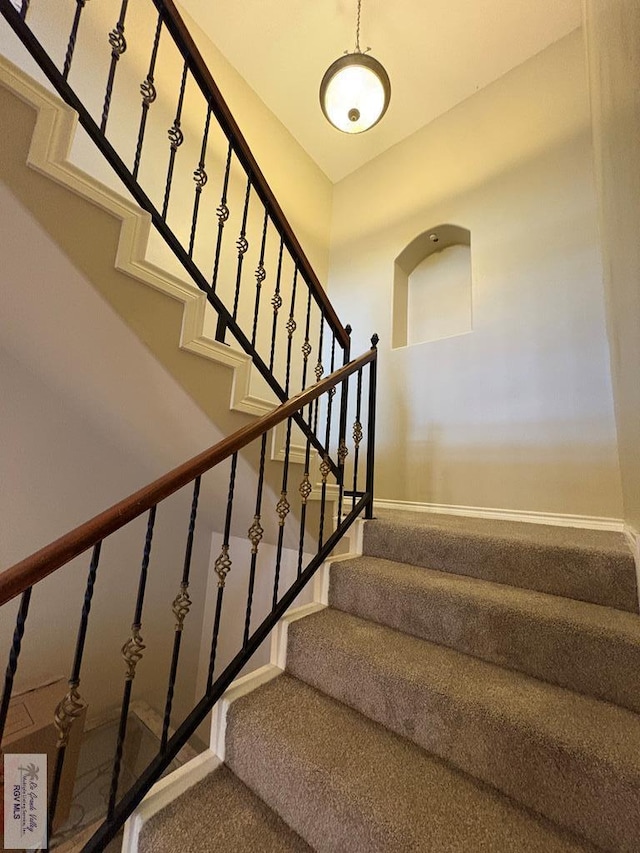 901 Plantation St, Brownsville, TX 78526 - stairs with carpet floors and baseboards