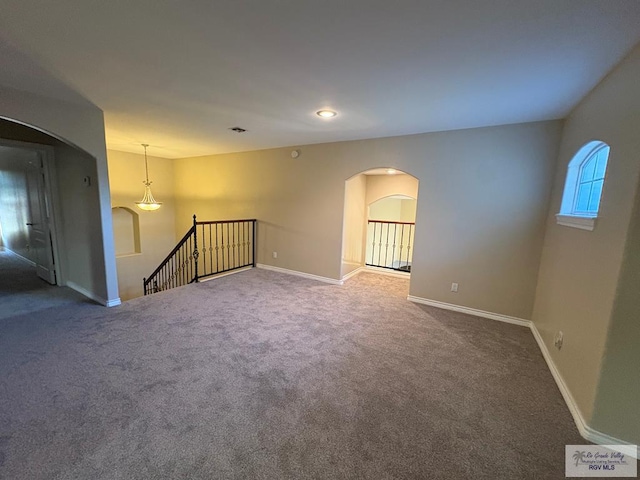 901 Plantation St, Brownsville, TX 78526 - empty room featuring arched walkways, carpet, baseboards, and recessed lighting