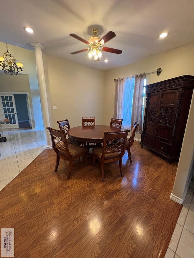 901 Plantation St, Brownsville, TX 78526 - dining space with a chandelier, ceiling fan, ornate columns, light wood-style flooring, and baseboards