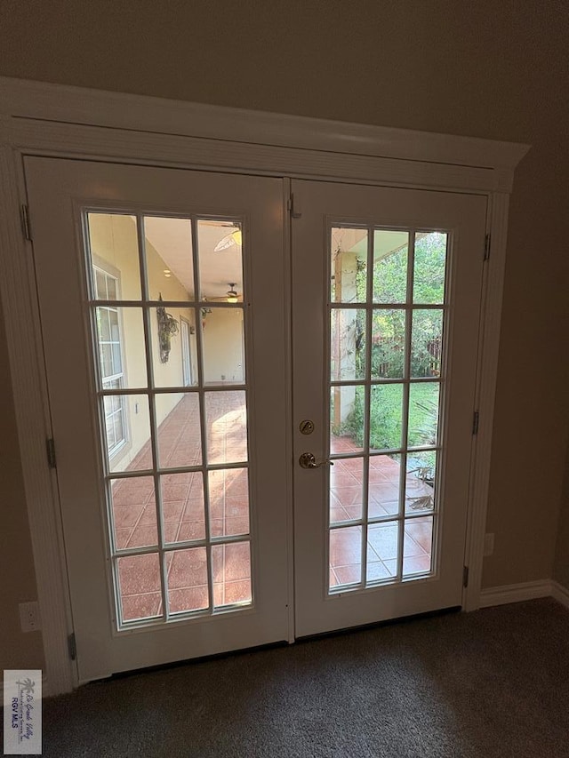 901 Plantation St, Brownsville, TX 78526 - doorway with carpet flooring, french doors, and baseboards