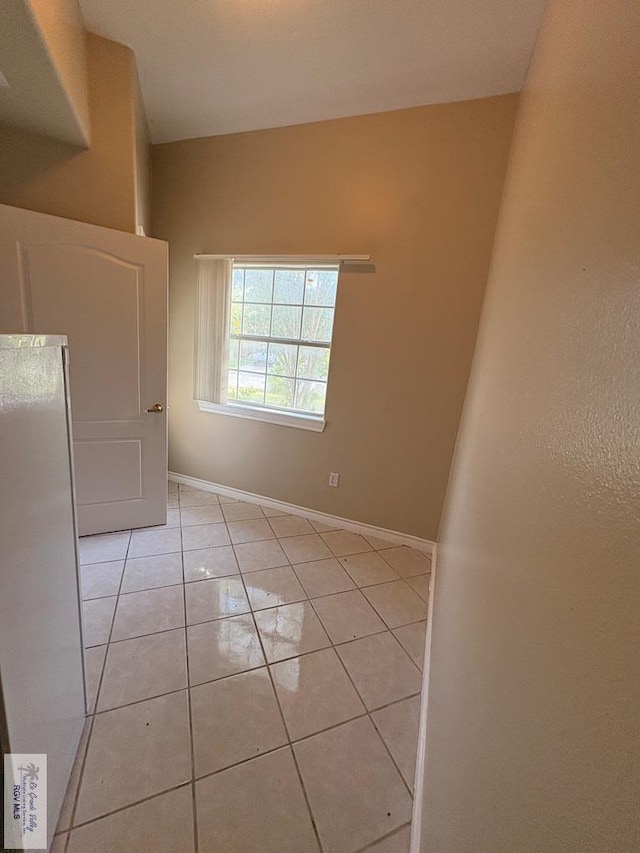 901 Plantation St, Brownsville, TX 78526 - spare room with light tile patterned floors and baseboards