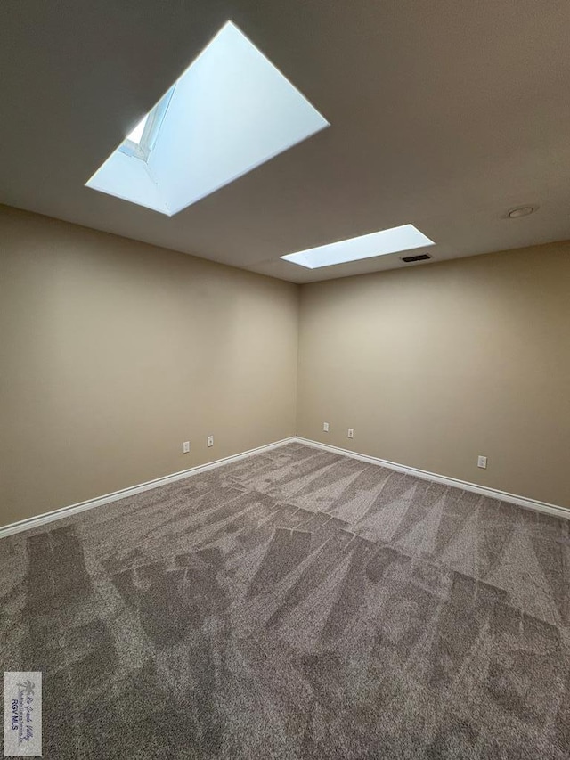 901 Plantation St, Brownsville, TX 78526 - spare room featuring a skylight, carpet floors, and baseboards