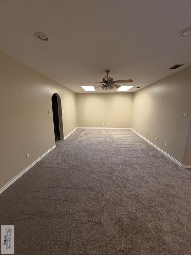 901 Plantation St, Brownsville, TX 78526 - carpeted empty room with arched walkways, ceiling fan, and baseboards