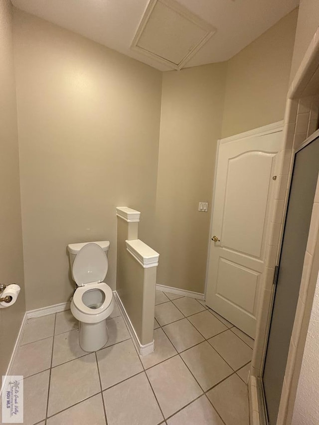 901 Plantation St, Brownsville, TX 78526 - full bathroom featuring tile patterned floors, toilet, a shower stall, and baseboards