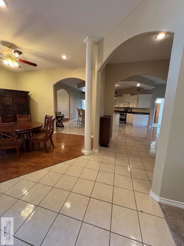901 Plantation St, Brownsville, TX 78526 - hall with light tile patterned flooring, recessed lighting, baseboards, and arched walkways
