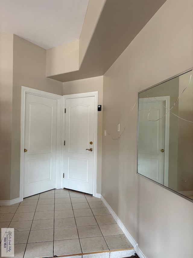 901 Plantation St, Brownsville, TX 78526 - corridor featuring light tile patterned flooring and baseboards