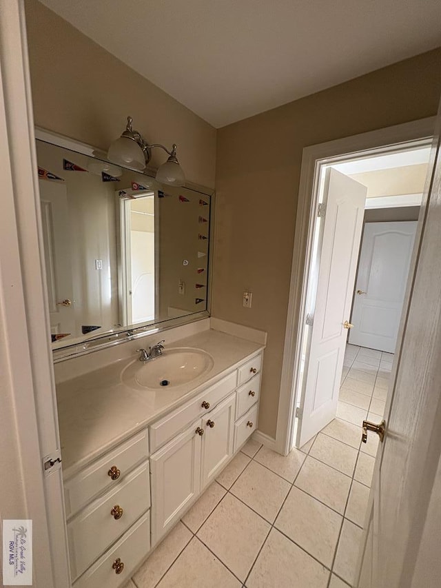 901 Plantation St, Brownsville, TX 78526 - bathroom featuring tile patterned floors and vanity