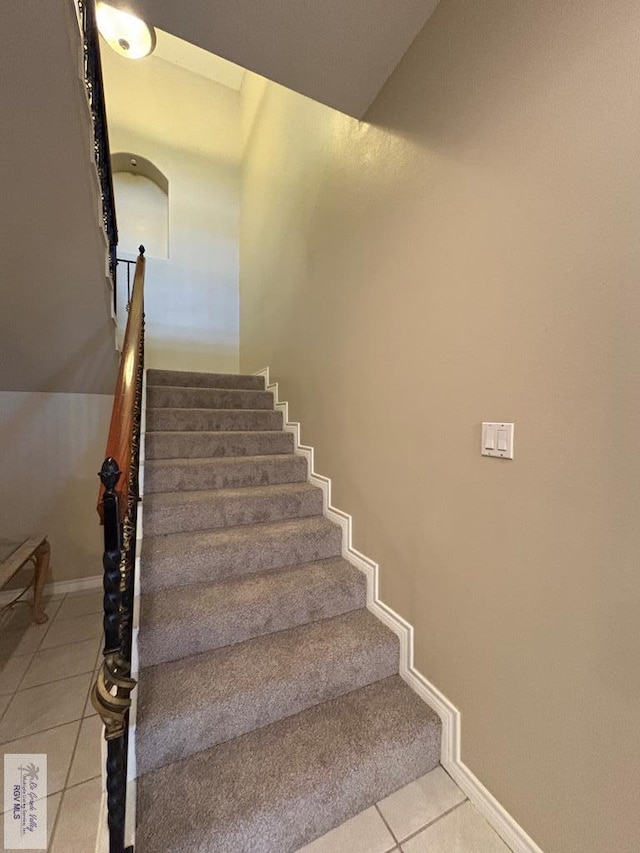 901 Plantation St, Brownsville, TX 78526 - staircase with tile patterned floors and baseboards