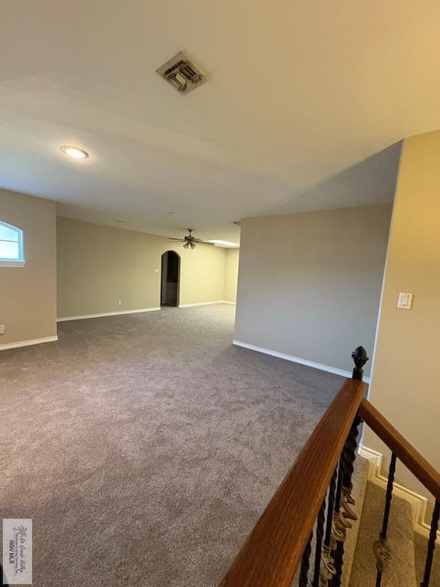 901 Plantation St, Brownsville, TX 78526 - unfurnished room featuring carpet floors, arched walkways, and baseboards