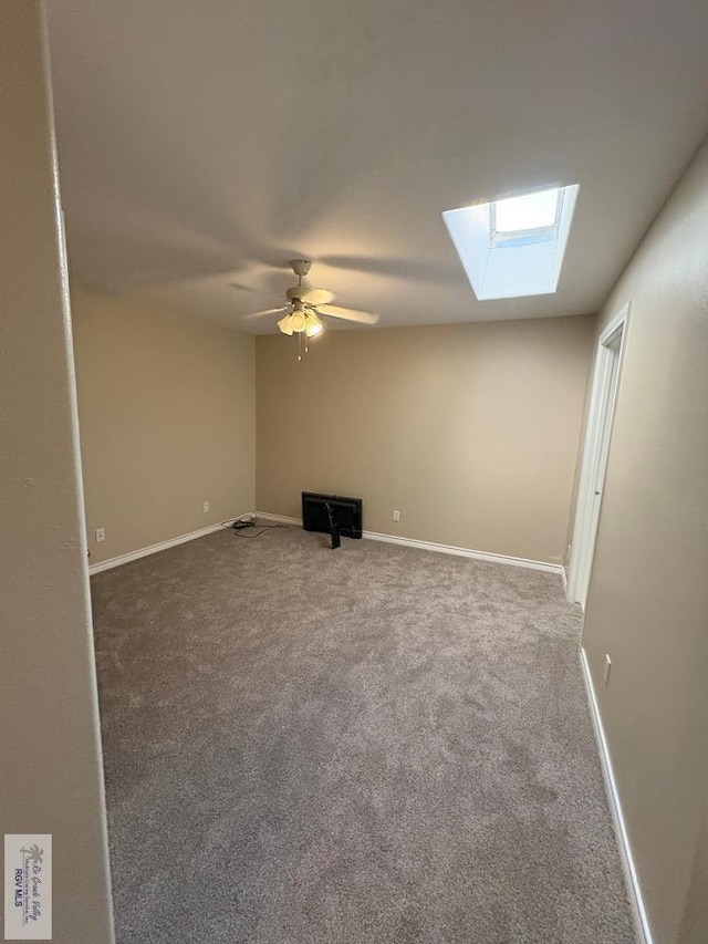 901 Plantation St, Brownsville, TX 78526 - carpeted spare room featuring a skylight, ceiling fan, and baseboards