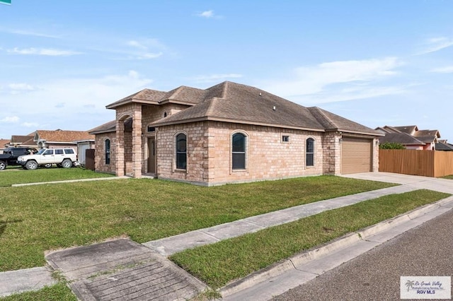 ranch-style home with a front lawn and a garage