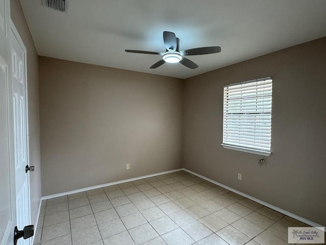 2805 Swiss Pine Ct, Harlingen, TX 78550 - spare room with a ceiling fan, baseboards, and light tile patterned floors