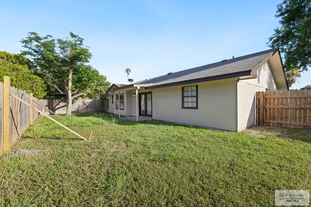 2805 Swiss Pine Ct, Harlingen, TX 78550 - back of house featuring brick siding and a fenced backyard