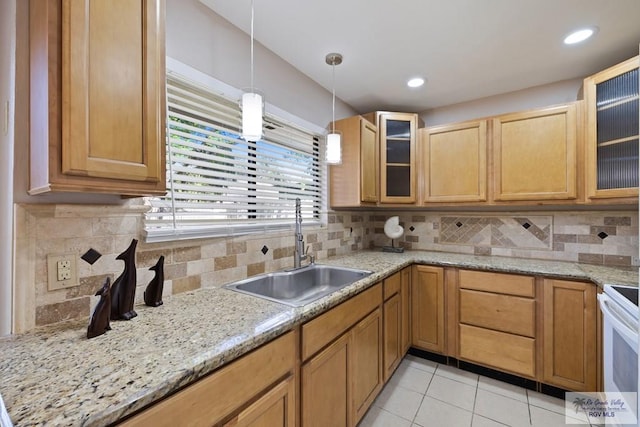 2805 Swiss Pine Ct, Harlingen, TX 78550 - kitchen with light tile patterned floors, hanging light fixtures, decorative backsplash, glass insert cabinets, and recessed lighting
