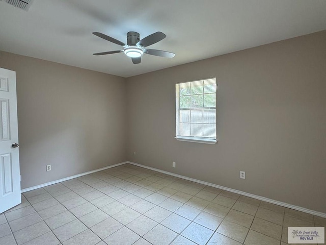 2805 Swiss Pine Ct, Harlingen, TX 78550 - spare room featuring ceiling fan, light tile patterned flooring, and baseboards