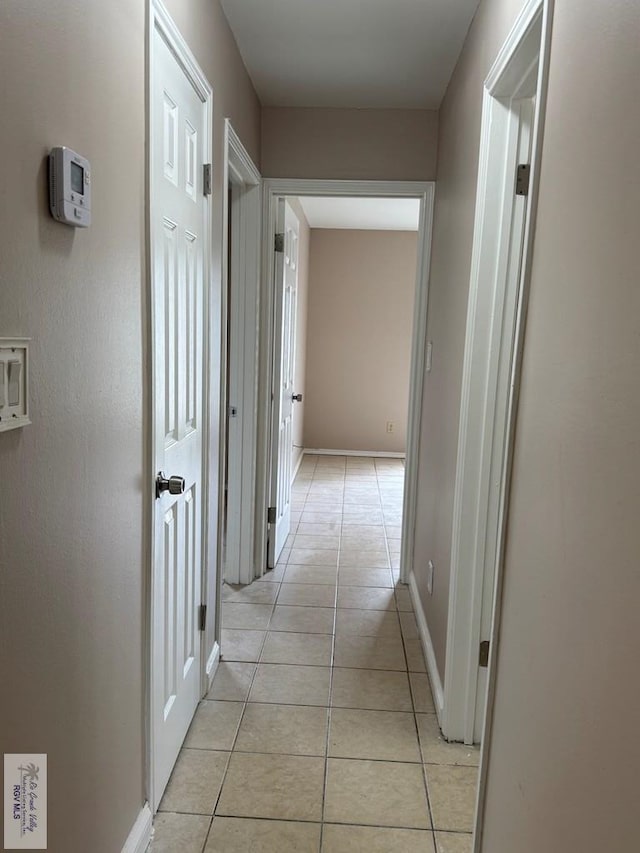 2805 Swiss Pine Ct, Harlingen, TX 78550 - hallway with light tile patterned flooring and baseboards