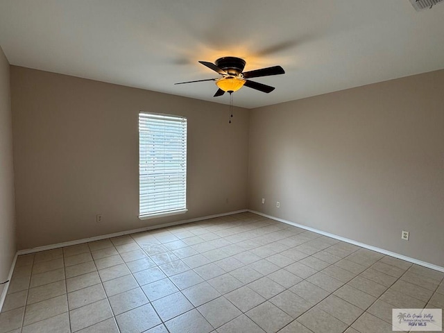 2805 Swiss Pine Ct, Harlingen, TX 78550 - unfurnished room with ceiling fan, light tile patterned flooring, and baseboards
