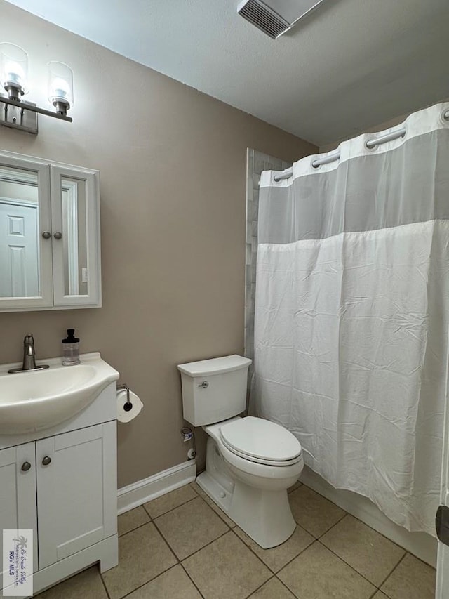 2805 Swiss Pine Ct, Harlingen, TX 78550 - bathroom featuring tile patterned flooring, toilet, vanity, and curtained shower