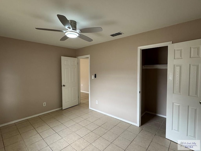 2805 Swiss Pine Ct, Harlingen, TX 78550 - unfurnished bedroom featuring light tile patterned floors, a closet, baseboards, and ceiling fan