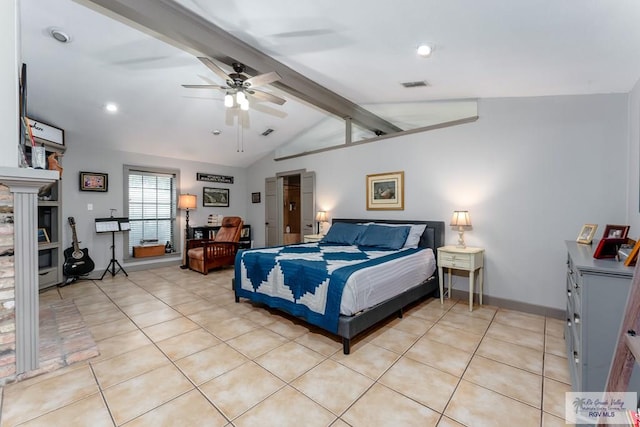 tiled bedroom with lofted ceiling with beams and ceiling fan