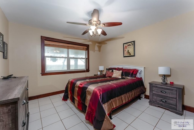 bedroom with ceiling fan and light tile patterned floors