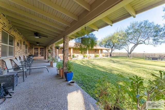 view of patio featuring ceiling fan and french doors