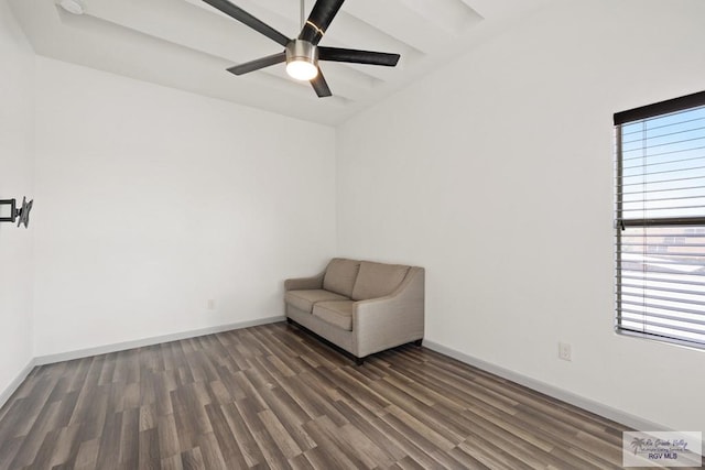 unfurnished room with ceiling fan and dark wood-type flooring