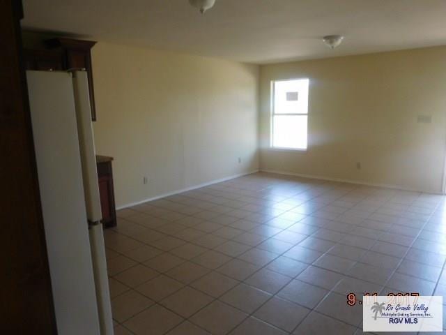 2100 Old Port Isabel Rd, Brownsville, TX 78526 - spare room featuring baseboards and light tile patterned floors