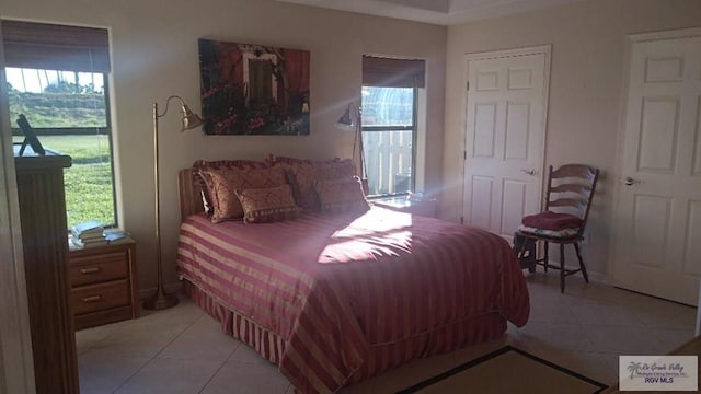 bedroom with light tile patterned flooring