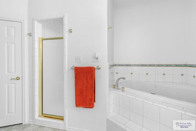 bathroom featuring shower with separate bathtub and tile patterned floors