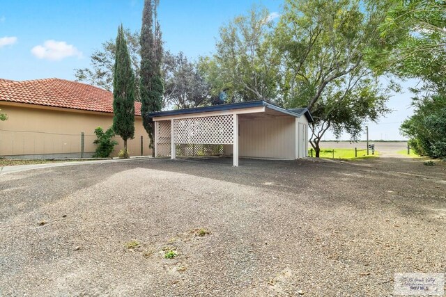 exterior space featuring a carport