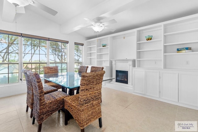 tiled dining area featuring vaulted ceiling with beams, ceiling fan, and plenty of natural light