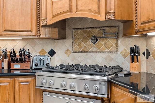 16408 Garrett Rd, Harlingen, TX 78552 - kitchen featuring dark countertops, brown cabinets, and decorative backsplash