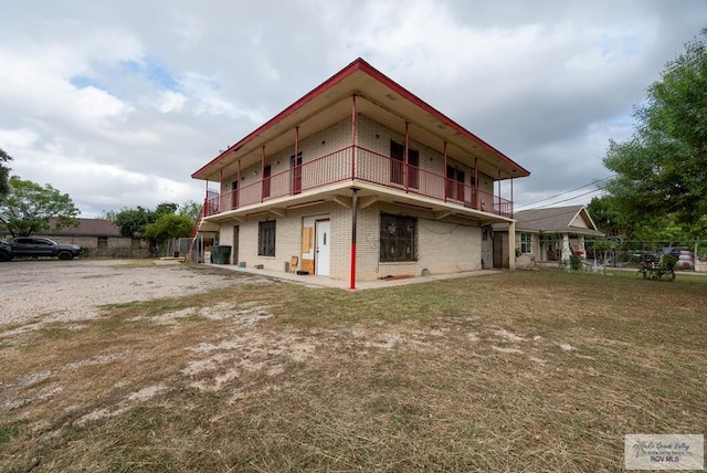 view of home's exterior featuring a balcony