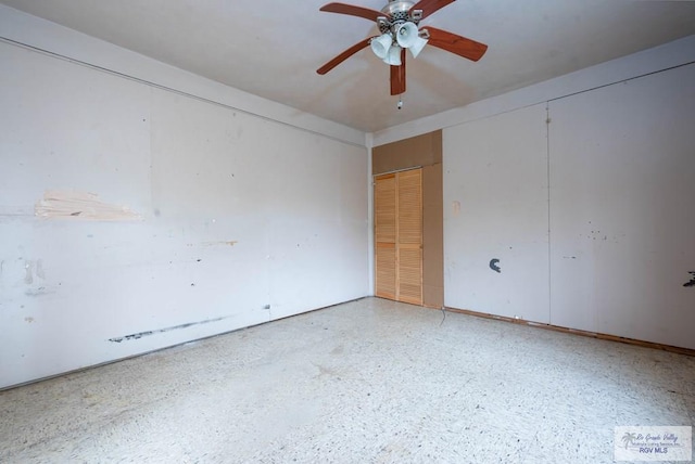 empty room featuring ceiling fan