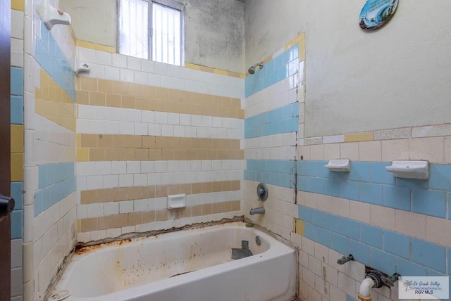 bathroom with tile walls