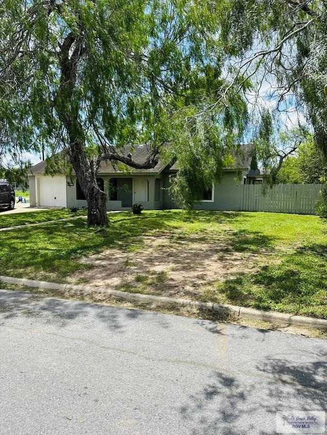 1201 Ben Lora Ln, San Benito, TX 78586 - view of front of property featuring stucco siding