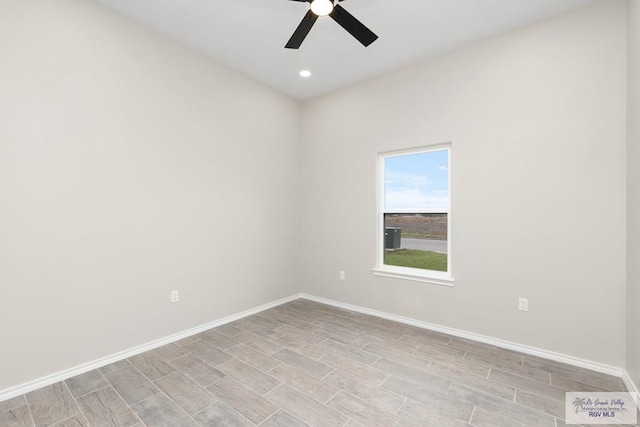 empty room featuring ceiling fan and light hardwood / wood-style floors