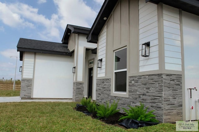 view of home's exterior featuring a lawn