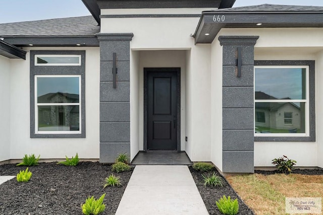 660 Tamarindo Ln Unit 2, Brownsville, TX 78521 - doorway to property featuring stucco siding