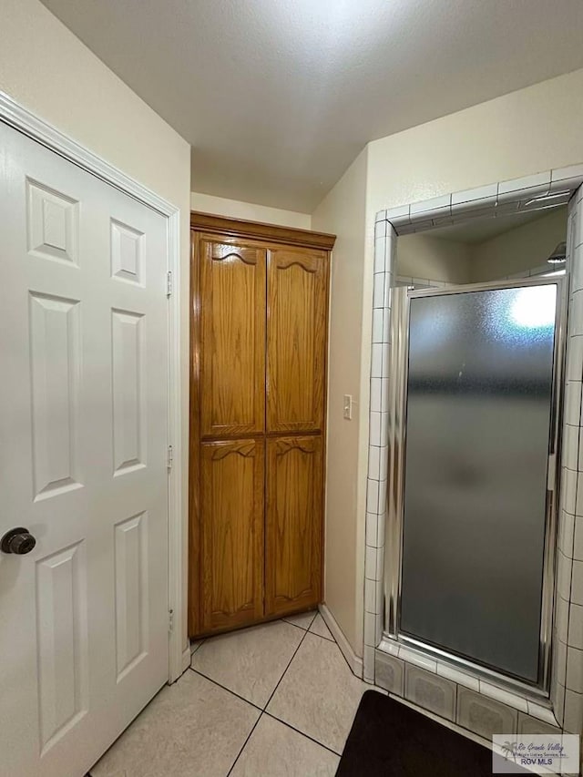 hallway with light tile patterned floors