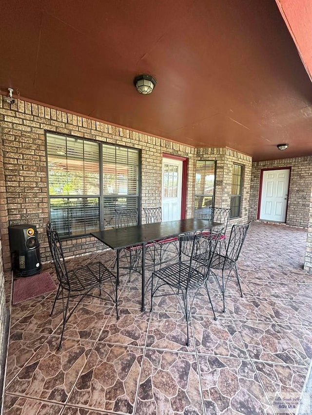 view of patio featuring outdoor dining area